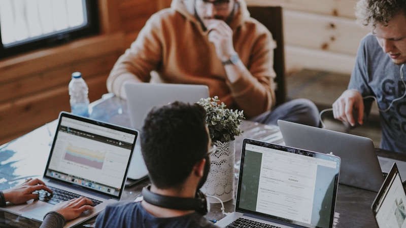 Person working on laptop from home as side hustle
